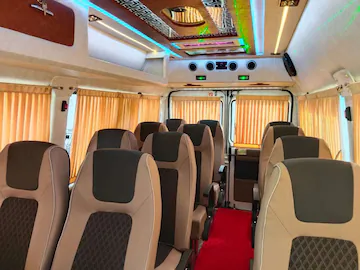 Maharaja 12 seater Tempo Traveller 1x1 luxury seating interior in Varanasi